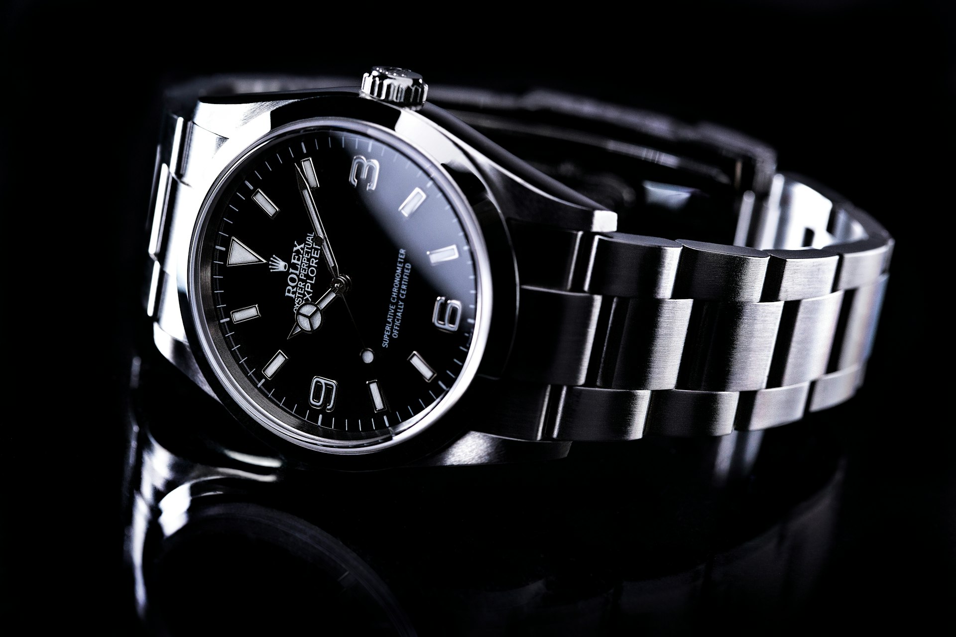 silver and black round analog watch